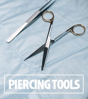Piercing tools on surgical material